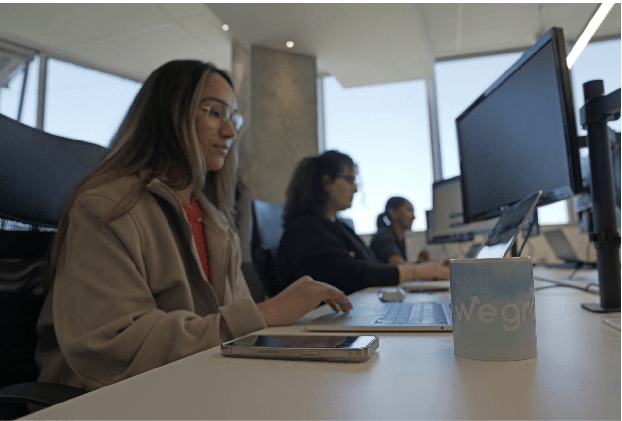 wegrow-office-employee-tapping-PC